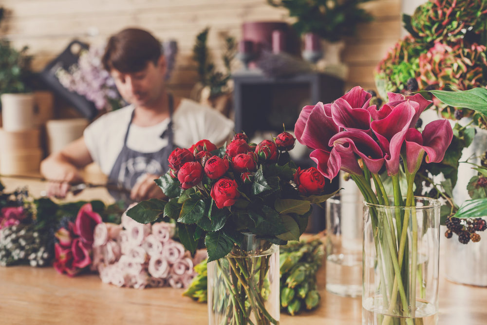Small,business.,male,florist,unfocused,in,flower,shop.,floral,design